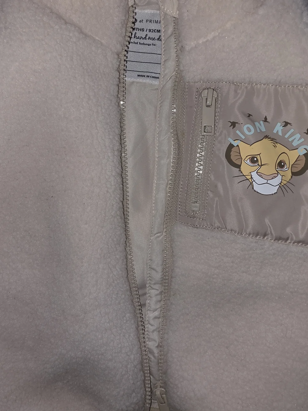 Primark Cream Sherpa Kids Vest with Lion King Patch